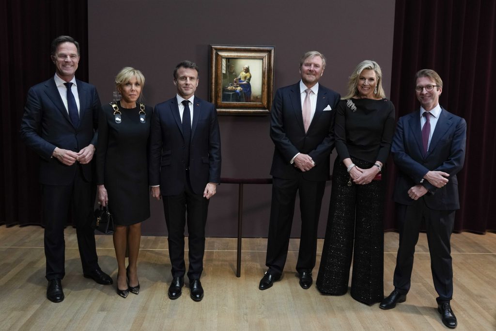 (L-R) Dutch Prime Minister Mark Rutte, France's First Lady Brigitte Macron, French President Emmanuel Macron, King Willem-Alexander of The Netherlands, Queen Maxima and Rijksmuseum director Taco Dibbits pose at the Vermeer exhibition which the French state guests visited at the Rijksmuseum in Amsterdam, The Netherlands, 12 April 2023. The French president and his wife are paying a two-day state visit to the Netherlands. EPA/PETER DE JONG / POOL